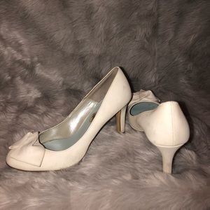 White heels with a bow